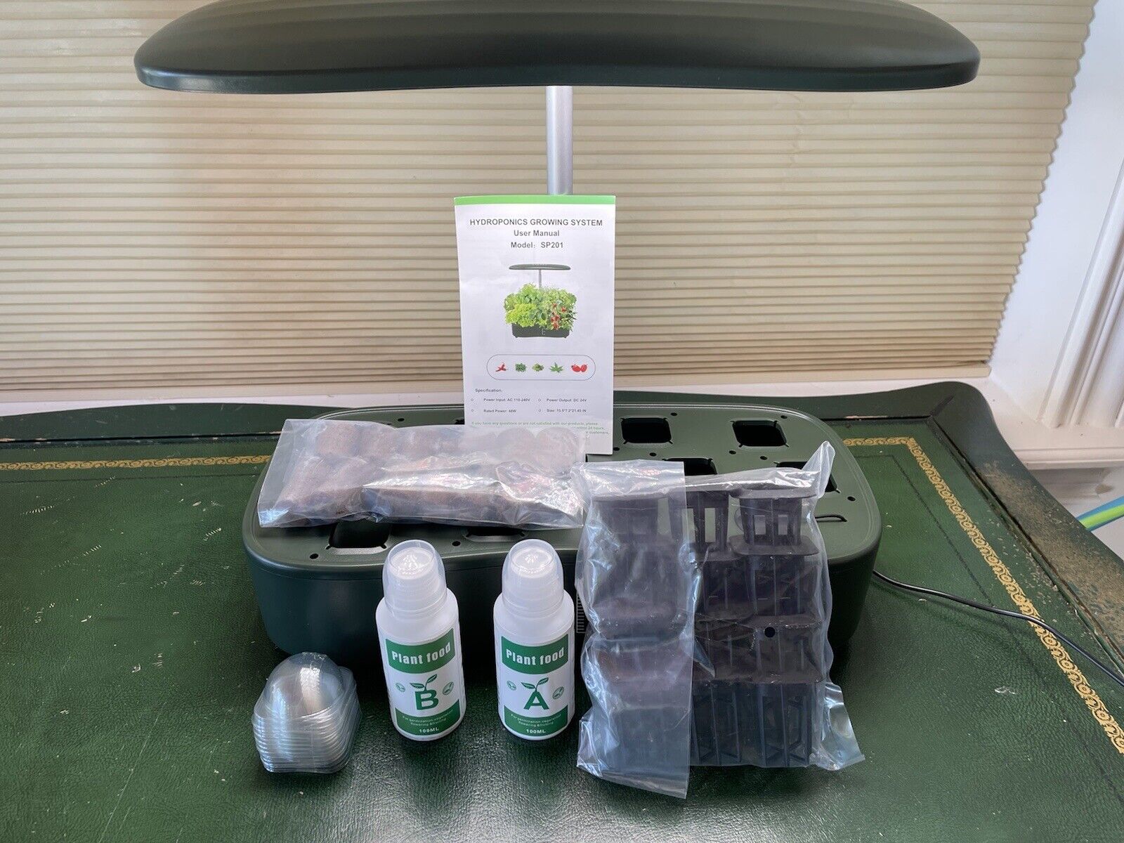 Hydroponic indoor garden growing system with 12 plant sites and 24 watts.